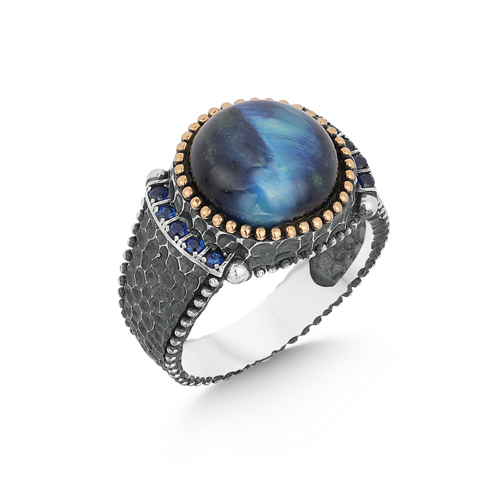 Circle blue tiger eye stone circled small yellow stones man’s ring with blue small zircone stones on sides 